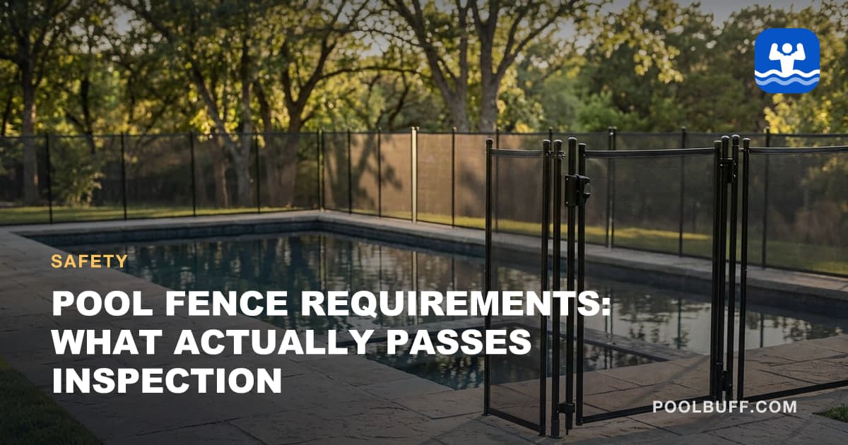 A tall mesh pool safety fence with a self-closing gate around a pool